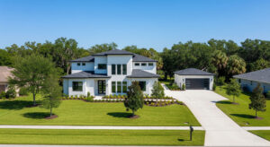 Home built on land with detached garage and garden space